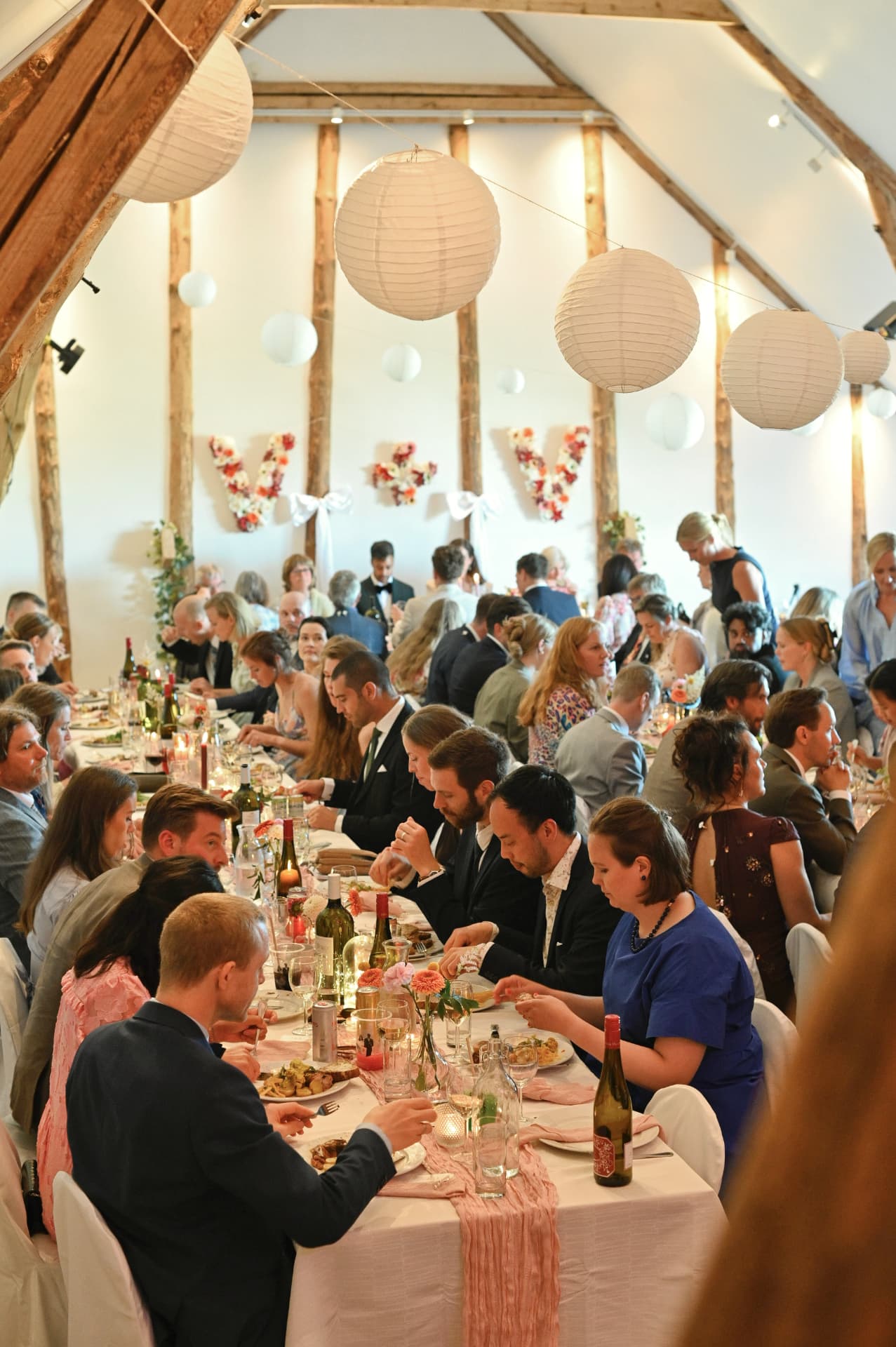 Long dinner tables in the barn