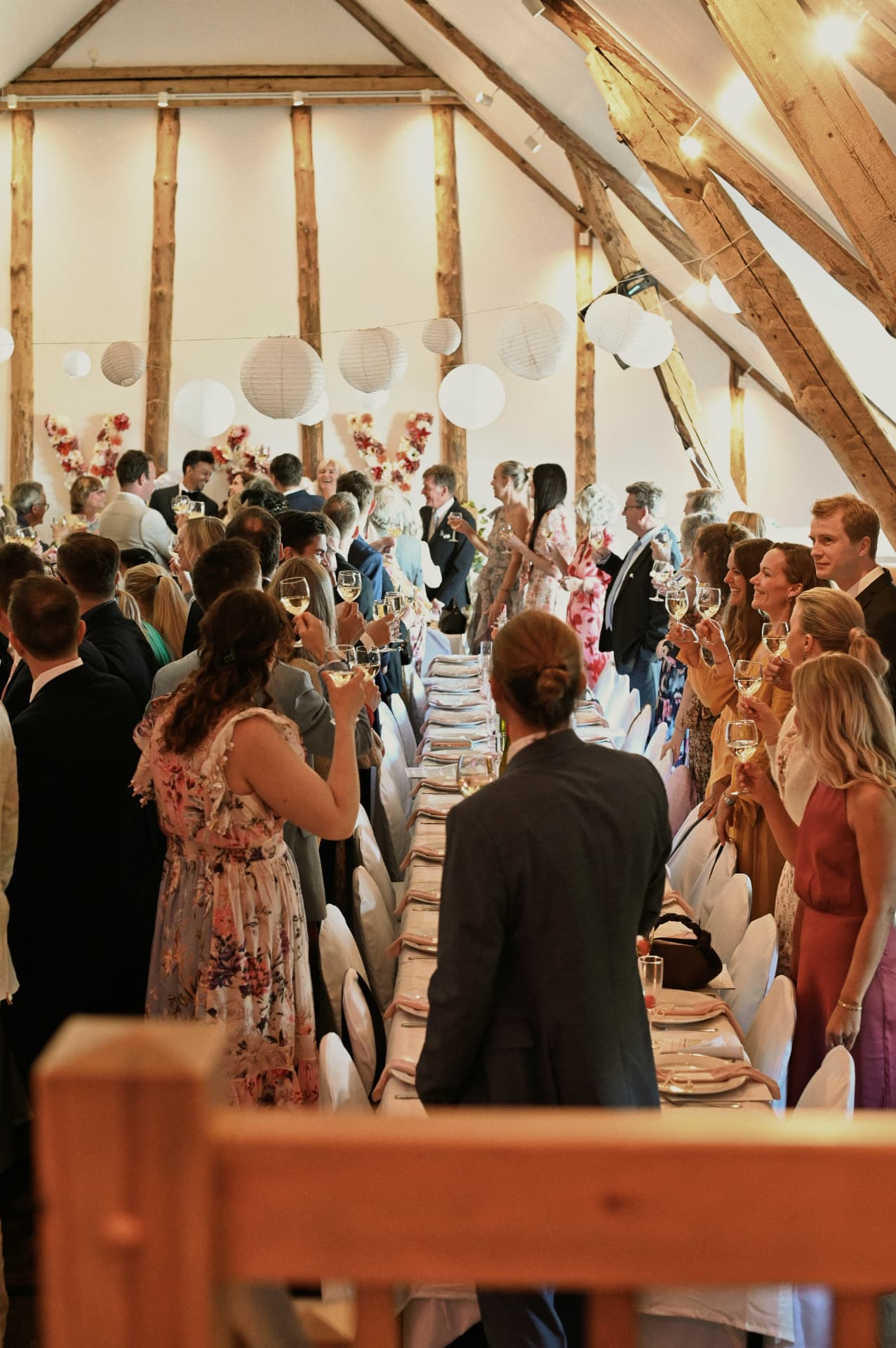 Guests raising glasses in the Stavanger barn