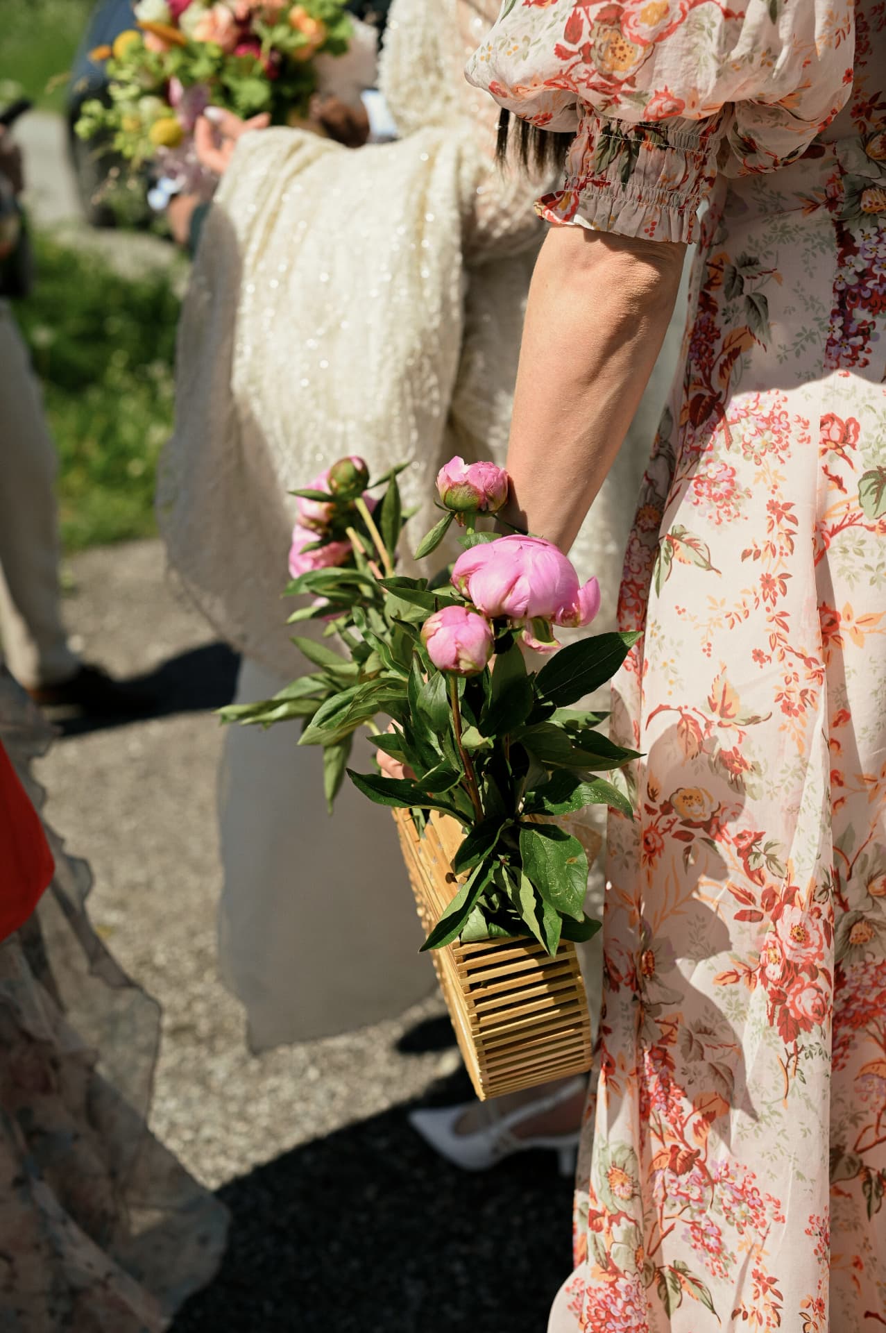 Peonies carried by a guest