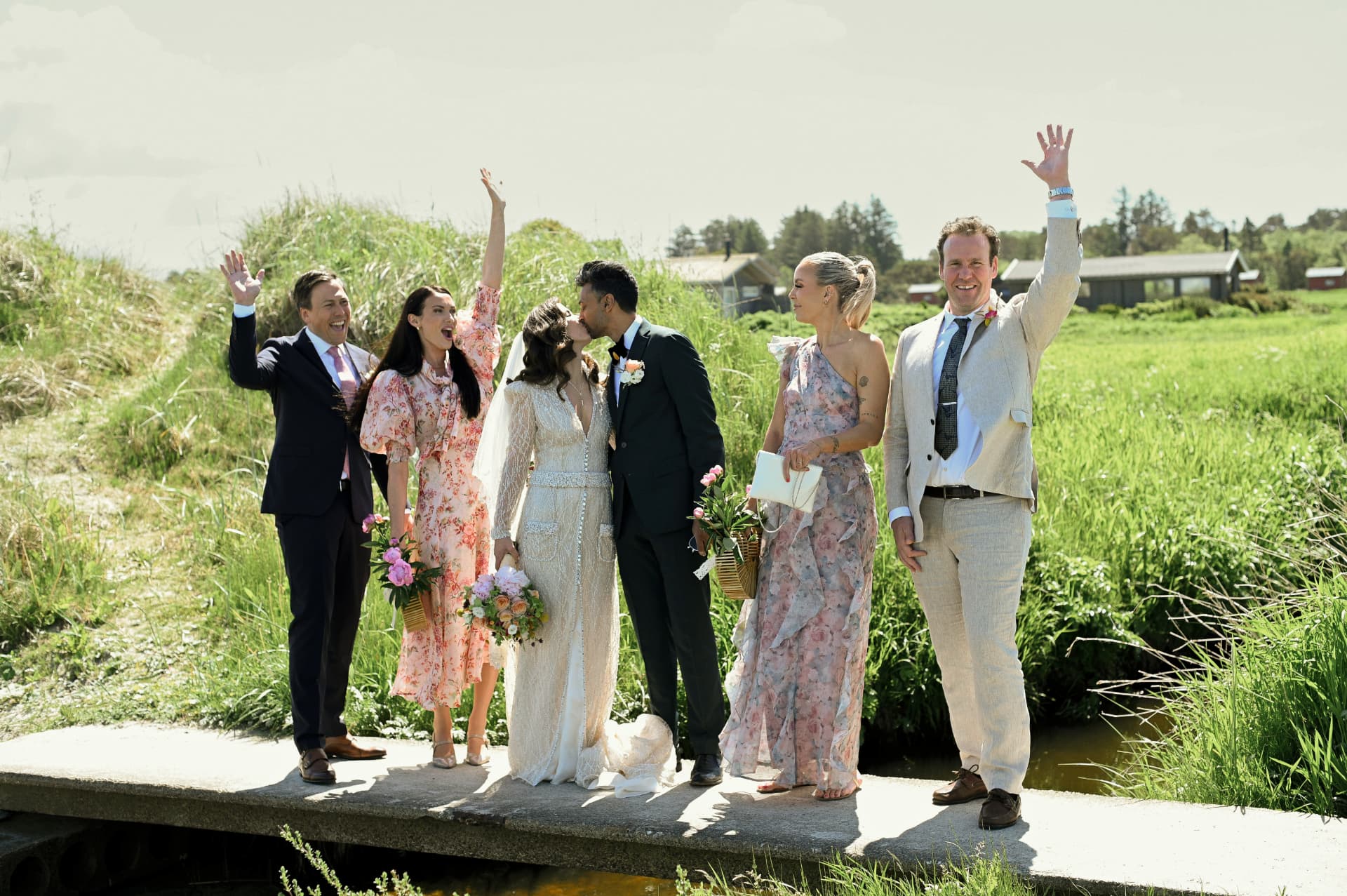 Guests celebrating the couple outdoors