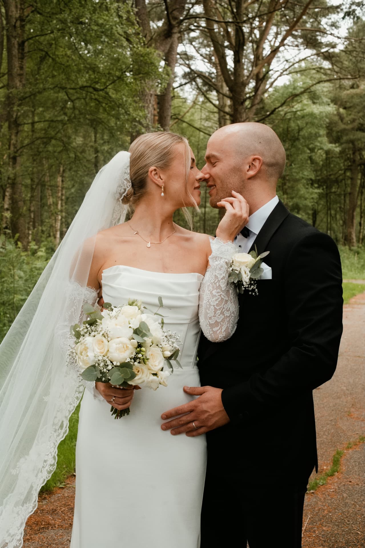 Couple sharing a moment on a woodland path